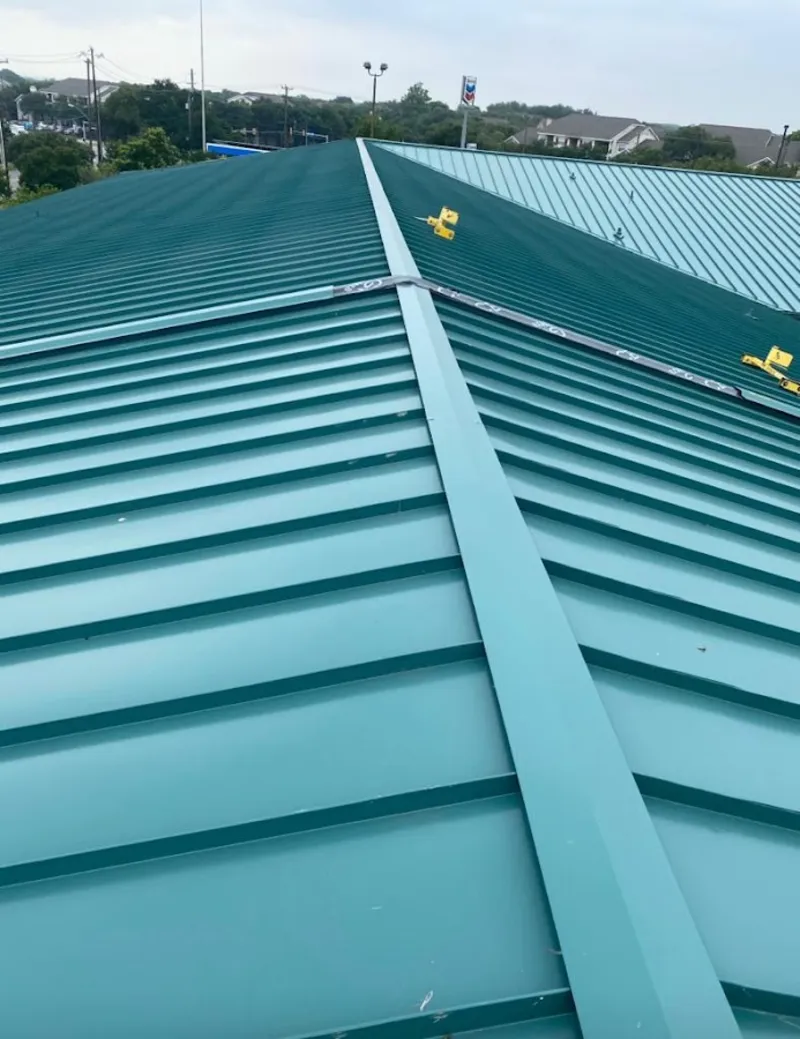 Green commercial metal roof ridge and valley for Metal Roof Repair in Glenwood Springs