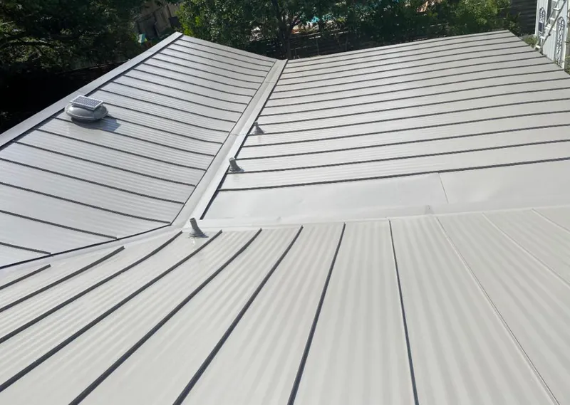 Solar attic fan installed on a metal roof for Roof Ventilation in Glenwood Springs